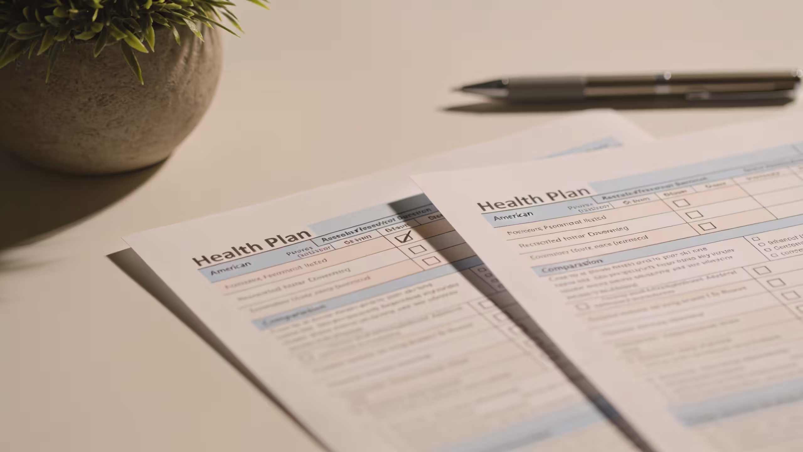 Health insurance deductible concept: printed medical bill and insurance documents on a clean desk with a calculator